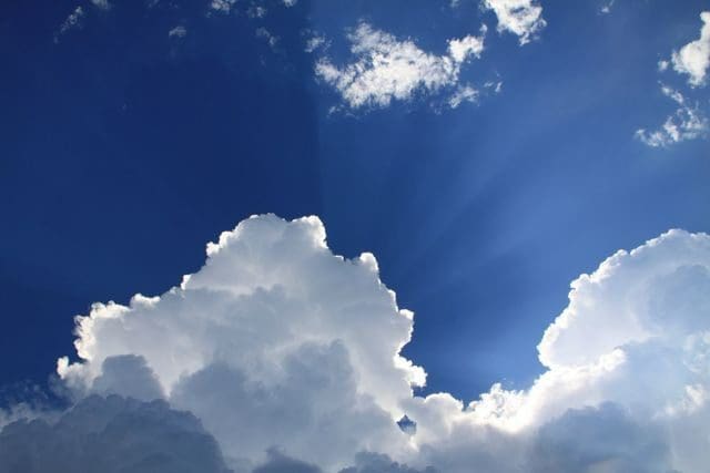 A cloud with the sun shining through it.