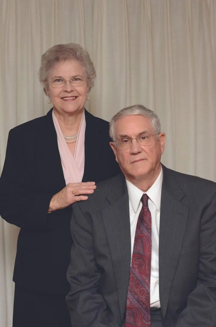 A man and woman posing for a picture.